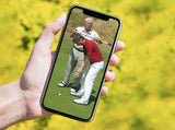 Man holding a phone with putting video