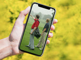 man holding a phone with karl morris on the screen