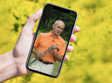 man holding a phone with short game video