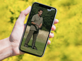 Person holding phone with Steve Gould on the screen.